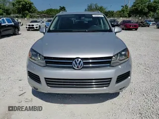 2014 Volkswagen Touareg Sport with VIN WVGEF9BP8ED005445, listed as a Copart auction lot 53694215 with 194,711 mi miles and Salvage Title. Bid and sale history available at DreamBid. Image 14.