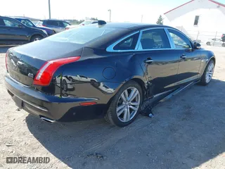 2018 Jaguar XJ with VIN SAJWJ2GD2J8W13463, listed as a IAAI auction lot 41897451 with 70,448 mi miles. Bid and sale history available at carsss.com. Image 4.