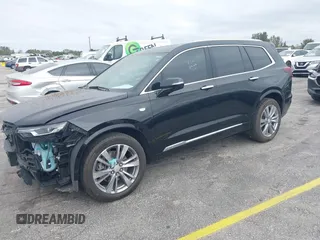 2023 Cadillac XT6 FWD Premium Luxury with VIN 1GYKPCRS6PZ106284, listed as a IAAI auction lot 41595617 with 32,795 mi miles and . Bid and sale history available at DreamBid. Image 2.