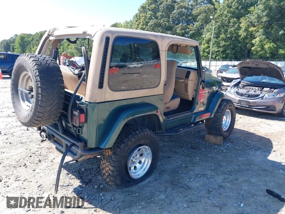 2001 Jeep Wrangler Sahara with VIN 1J4FA59S71P340368, listed as a IAAI auction lot 40148603 with 138,710 mi miles. Bid and sale history available at carsss.com. Image 4.