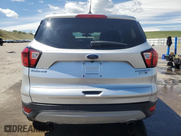 2019 Ford Escape Titanium с VIN 1FMCU9J90KUB85595, выставлен на аукционе Copart как лот 57410045 с пробегом 47 995 миль миль и Списание • Salvage title. История ставок и продаж доступна на DreamBid. Изображение 6.