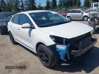 2023 Kia Rio LX z VIN 3KPA24AD5PE615877, wystawiony jako IAAI lot #42324236 z przebiegiem 18 210 mil mil oraz . Historia ofert i sprzedaży dostępna na DreamBid. Obrazek 1.
