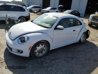 2016 Volkswagen Beetle Wolfsburg Edition with VIN 3VWF17AT0GM632039, listed as a Copart auction lot 51226105 with 124,155 mi miles and Salvage title. Bid and sale history available at DreamBid. Image 1.