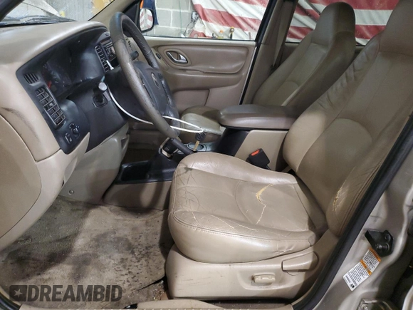2001 Mazda Tribute LX with VIN 4F2CU08101KM05943, listed as a Copart auction lot 84077694 with 137,937 mi miles and Salvage Title. Bid and sale history available at DreamBid. Image 7.