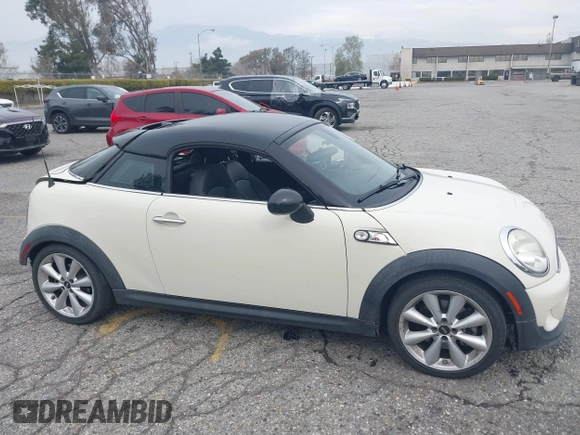 2013 MINI Coupe S with VIN WMWSX3C53DT466648, listed as a IAAI auction lot 41719597 with 106,936 mi miles and . Bid and sale history available at DreamBid. Image 14.