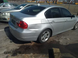 2008 BMW 3 Series 328i with VIN WBAVA37588NL53989, listed as a IAAI auction lot 38807371 with 179,844 mi miles. Bid and sale history available at carsss.com. Image 6.