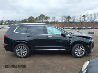 2021 Cadillac XT6 Premium Luxury with VIN 1GYKPCRSXMZ222454, listed as a IAAI auction lot 41648439 with 113,547 mi miles and . Bid and sale history available at carsss.com. Image 13.