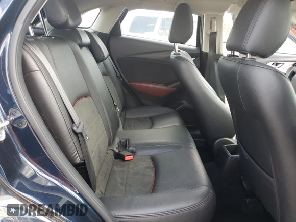 2018 Mazda CX-3 Grand Touring z VIN JM1DKFD79J0329416, wystawiony jako Copart lot #51708325 z przebiegiem 64 597 mil mil oraz Szkody całkowita. Historia ofert i sprzedaży dostępna na DreamBid. Obrazek 11.
