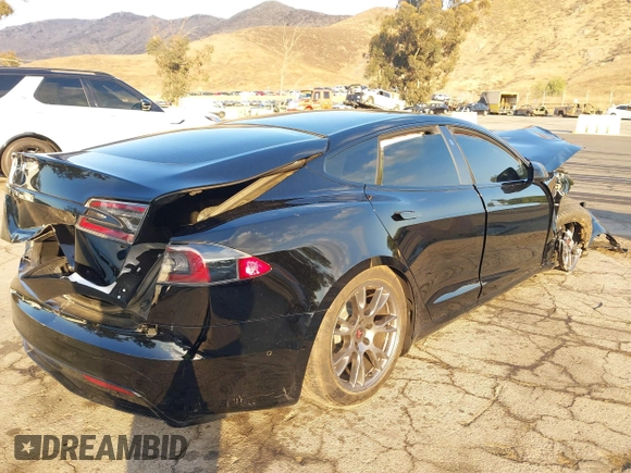 2022 Tesla Model S with VIN 5YJSA1E50NF462647, listed as a IAAI auction lot 41354668 with Not Provided miles and . Bid and sale history available at DreamBid. Image 4.