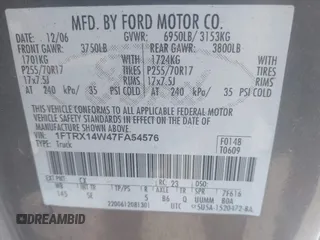 2007 Ford F-150 STX with VIN 1FTRX14W47FA54576, listed as a IAAI auction lot 41971521 with 220,945 mi miles. Bid and sale history available at carsss.com. Image 9.