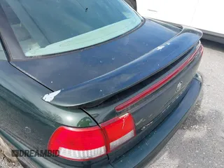 2000 Cadillac Catera z VIN W06VR54R0YR002664, wystawiony jako IAAI lot #41857553 z przebiegiem 86 354 mil mil oraz . Historia ofert i sprzedaży dostępna na DreamBid. Obrazek 13.