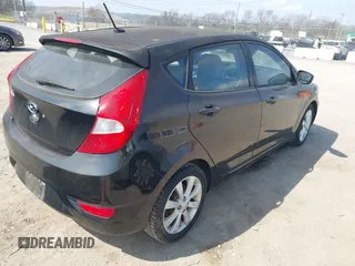 2012 Hyundai Accent SE with VIN KMHCU5AE8CU015055, listed as a IAAI auction lot 41814610 with 141,769 mi miles. Bid and sale history available at carsss.com. Image 4.