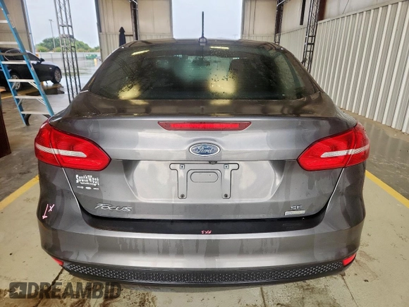 2018 Ford Focus SE with VIN 1FADP3FE0JL311760, listed as a Copart auction lot 63621755 with 81,000 mi miles and Salvage title. Bid and sale history available at DreamBid. Image 6.