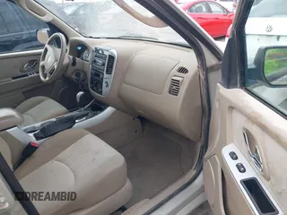 2005 Mercury Mariner Convenience z VIN 4M2YU57Z85DJ28652, wystawiony jako IAAI lot #41524903 z przebiegiem 228 497 mil mil oraz . Historia ofert i sprzedaży dostępna na DreamBid. Obrazek 5.