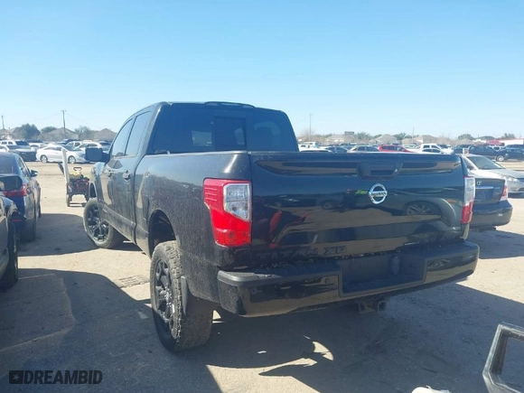 2018 Nissan Titan XD Platinum Reserve with VIN 1N6BA1F44JN522847, listed as a IAAI auction lot 41471499 with 119,124 mi miles. Bid and sale history available at carsss.com. Image 3.