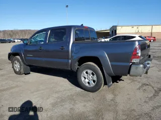 2015 Toyota Tacoma with VIN 3TMLU4EN7FM164526, listed as a Copart auction lot 50977395 with 124,222 mi miles and Salvage Title. Bid and sale history available at carsss.com. Image 2.