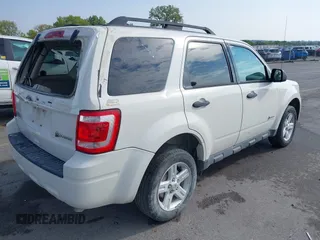 2010 Ford Escape Hybrid z VIN 1FMCU5K31AKD22069, wystawiony jako IAAI lot #40151027 z przebiegiem 185 932 mil mil oraz . Historia ofert i sprzedaży dostępna na DreamBid. Obrazek 4.