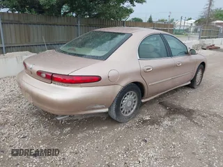 1996 Mercury Sable LS z VIN 1MELM53S1TG638988, wystawiony jako IAAI lot #42523616 z przebiegiem 87 087 mil mil oraz . Historia ofert i sprzedaży dostępna na DreamBid. Obrazek 4.