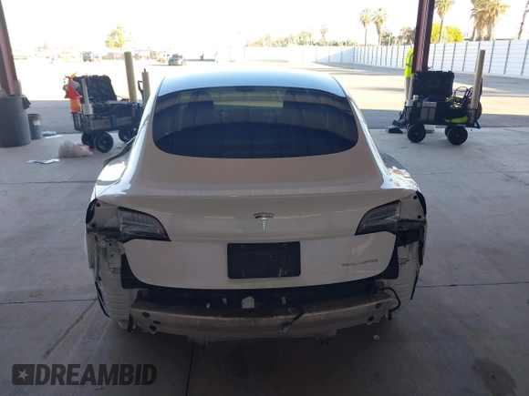 2021 Tesla Model 3 Long Range with VIN 5YJ3E1EB3MF003027, listed as a IAAI auction lot 41859036 with 102,302 mi miles and . Bid and sale history available at carsss.com. Image 17.