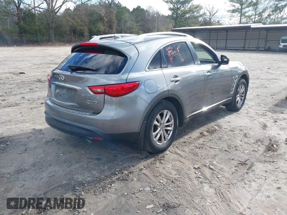 2015 Infiniti QX70 with VIN JN8CS1MWXFM480906, listed as a IAAI auction lot 41177811 with 176,527 mi miles and . Bid and sale history available at DreamBid. Image 4.