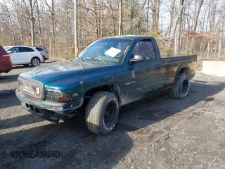 1999 Dodge Dakota SLT with VIN 1B7FL26X0XS208461, listed as a IAAI auction lot 41492338 with 185,400 mi miles. Bid and sale history available at carsss.com. Image 2.