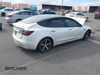 2019 Tesla Model 3 Mid Range with VIN 5YJ3E1EA6KF396946, listed as a IAAI auction lot 41123058 with 69,013 mi miles and . Bid and sale history available at carsss.com. Image 4.