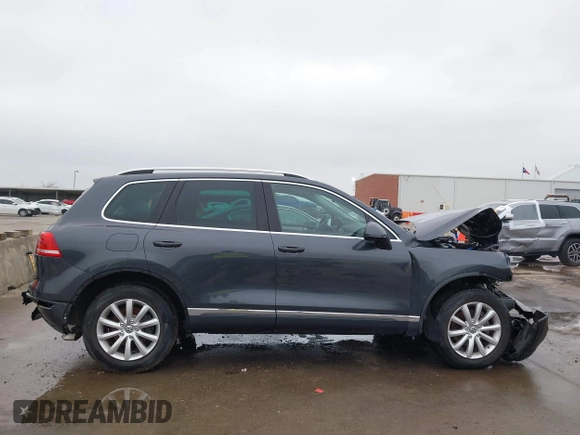 2012 Volkswagen Touareg Sport with VIN WVGEF9BP9CD008545, listed as a IAAI auction lot 41492653 with 138,424 mi miles and . Bid and sale history available at DreamBid. Image 14.