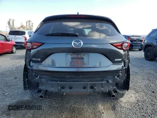 2018 Mazda CX-5 Grand Touring with VIN JM3KFADM8J1330353, listed as a Copart auction lot 54752325 with 96,577 mi miles and Salvage Title. Bid and sale history available at DreamBid. Image 6.