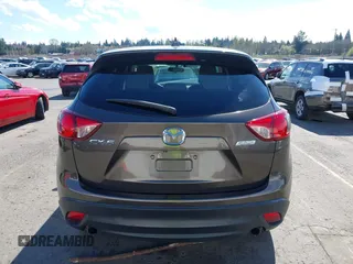 2016 Mazda CX-5 Grand Touring with VIN JM3KE2DYXG0773663, listed as a IAAI auction lot 41896367 with 86,571 mi miles and . Bid and sale history available at DreamBid. Image 17.
