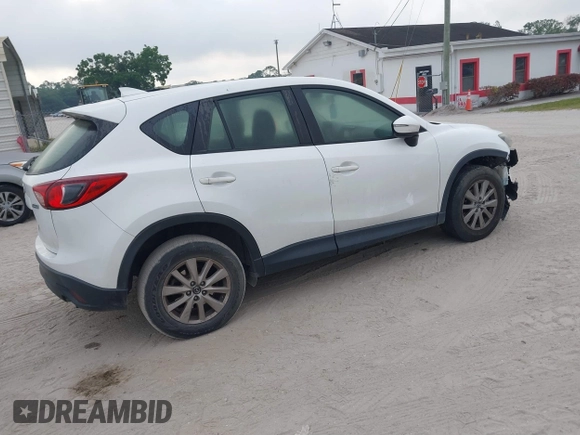 2016 Mazda CX-5 Sport with VIN JM3KE2BY1G0875484, listed as a IAAI auction lot 41838122 with 166,986 mi miles. Bid and sale history available at carsss.com. Image 4.