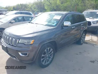 2017 Jeep Grand Cherokee Overland z VIN 1C4RJECG1HC614740, wystawiony jako IAAI lot #41912523 z przebiegiem 177 353 mil mil oraz . Historia ofert i sprzedaży dostępna na DreamBid. Obrazek 2.