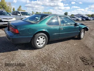 1995 Ford Thunderbird LX z VIN 1FALP6248SH176946, wystawiony jako Copart lot #74066554 z przebiegiem 72 666 mil mil oraz Szkoda całkowita • Salvage title. Historia ofert i sprzedaży dostępna na DreamBid. Obrazek 3.