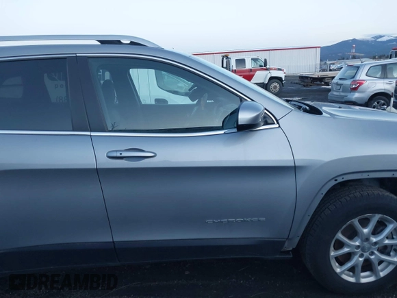 2014 Jeep Cherokee Latitude with VIN 1C4PJMCSXEW220556, listed as a IAAI auction lot 41060501 with 70,152 mi miles and . Bid and sale history available at carsss.com. Image 13.