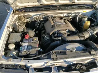 1998 Honda Passport LX with VIN 4S6CM58W0W4404170, listed as a Copart auction lot 83777484 with 181,140 mi miles and Salvage title. Bid and sale history available at DreamBid. Image 14.