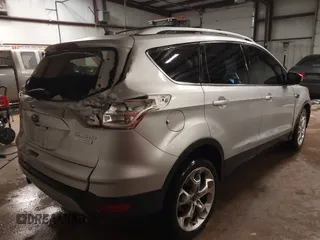 2013 Ford Escape Titanium z VIN 1FMCU0J94DUA93128, wystawiony jako IAAI lot #41612072 z przebiegiem 174 274 mil mil oraz . Historia ofert i sprzedaży dostępna na DreamBid. Obrazek 4.