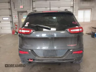 2016 Jeep Cherokee Trailhawk with VIN 1C4PJMBS2GW309042, listed as a IAAI auction lot 41564925 with 125,436 mi miles. Bid and sale history available at carsss.com. Image 17.