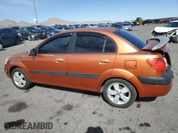 2009 Kia Rio SX with VIN KNADE223496514284, listed as a Copart auction lot 48550105 with 114,411 mi miles and Salvage Title. Bid and sale history available at carsss.com. Image 2.