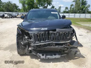 2013 Jeep Grand Cherokee Laredo with VIN 1C4RJEAG2DC519570, listed as a Copart auction lot 52066225 with 129,091 mi miles and Salvage Title. Bid and sale history available at carsss.com. Image 5.