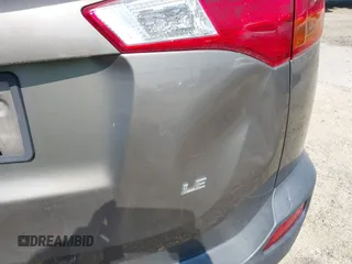 2014 Toyota RAV4 LE with VIN JTMZFREVXED034316, listed as a IAAI auction lot 42610135 with 214,871 mi miles and . Bid and sale history available at DreamBid. Image 6.