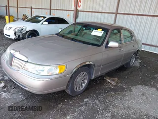 2000 Lincoln Town Car Signature z VIN 1LNHM82W1YY869805, wystawiony jako IAAI lot #42051938 z przebiegiem 125 940 mil mil oraz . Historia ofert i sprzedaży dostępna na DreamBid. Obrazek 18.