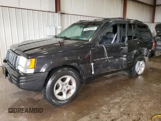 1998 Jeep Grand Cherokee Limited z VIN 1J4GZ88Z0WC276394, wystawiony jako Copart lot #46702355 z przebiegiem 144 232 mil mil oraz Szkoda całkowita • Salvage title. Historia ofert i sprzedaży dostępna na DreamBid. Obrazek 1.