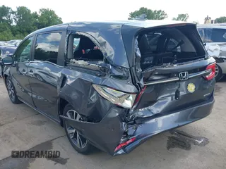 2022 Honda Odyssey Touring with VIN 5FNRL6H89NB008814, listed as a IAAI auction lot 42597738 with 49,933 mi miles and . Bid and sale history available at DreamBid. Image 3.
