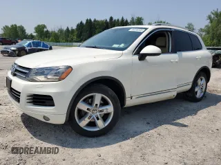 2012 Volkswagen Touareg Sport with VIN WVGFF9BP1CD001903, listed as a Copart auction lot 60236595 with 187,656 mi miles and Salvage title. Bid and sale history available at DreamBid. Image 1.