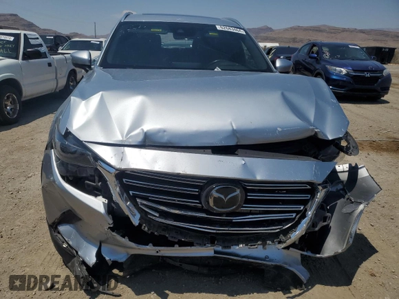 2021 Mazda CX-9 Grand Touring z VIN JM3TCADY4M0512268, wystawiony jako Copart lot #62683464 z przebiegiem Nie podano mil oraz Szkoda całkowita • Salvage title. Historia ofert i sprzedaży dostępna na DreamBid. Obrazek 5.