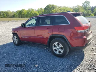 2014 Jeep Grand Cherokee Laredo with VIN 1C4RJEAG7EC274573, listed as a Copart auction lot 52637255 with 156,409 mi miles and Salvage Title. Bid and sale history available at DreamBid. Image 2.
