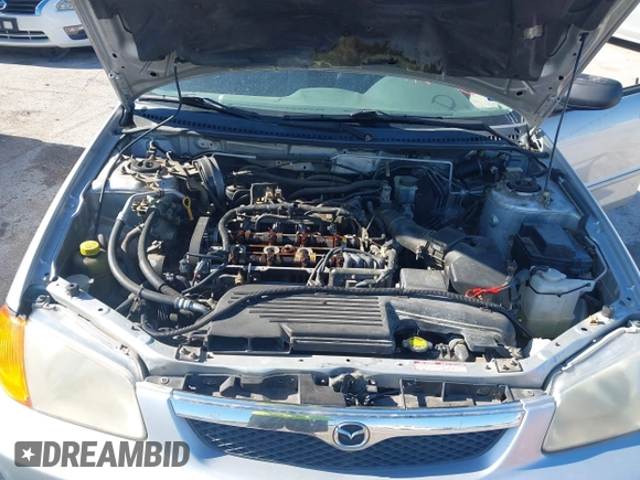 2000 Mazda Protege ES with VIN JM1BJ2213Y0284890, listed as a IAAI auction lot 42088671 with 215,104 mi miles and . Bid and sale history available at DreamBid. Image 10.