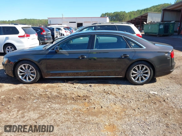 2011 Audi A8 with VIN WAURVAFDXBN014290, listed as a IAAI auction lot 40860777 with 152,584 mi miles and . Bid and sale history available at DreamBid. Image 14.
