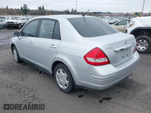 2007 Nissan Versa 1.8 SL with VIN 3N1BC11E97L447829, listed as a IAAI auction lot 41612386 with 123,500 mi miles. Bid and sale history available at carsss.com. Image 3.