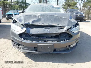 2018 Ford Fusion SE z VIN 3FA6P0LU6JR118226, wystawiony jako IAAI lot #41811406 z przebiegiem 165 352 mil mil oraz . Historia ofert i sprzedaży dostępna na DreamBid. Obrazek 6.