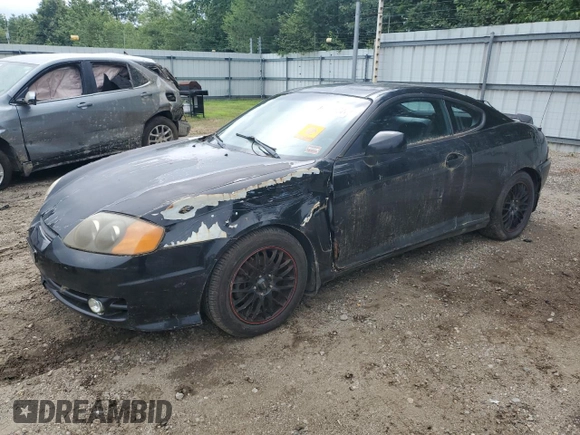 2003 Hyundai Tiburon GT z VIN KMHHN65F83U101784, wystawiony jako Copart lot #41566805 z przebiegiem 99 970 mil mil oraz Nie do naprawy • Non repairable. Historia ofert i sprzedaży dostępna na DreamBid. Obrazek 1.